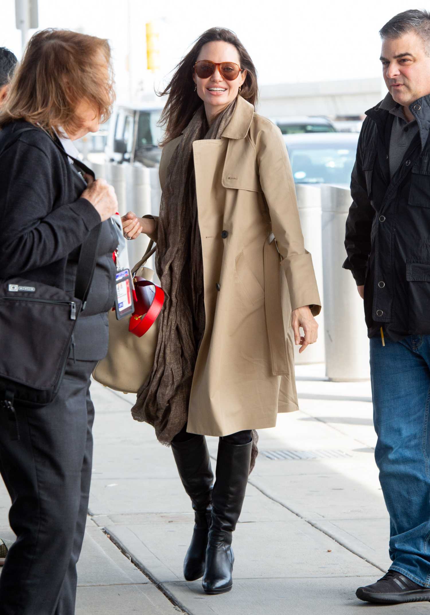 Angelina Jolie in a Beige Trench Coat Arrives at JFK Airport in NYC – Celeb Donut