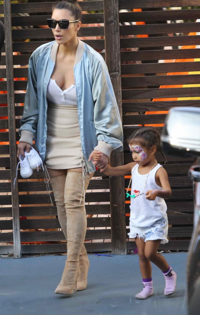 Kim Kardashian and Kourtney Kardashian Leaving a Kids' Party in Los Angeles-1