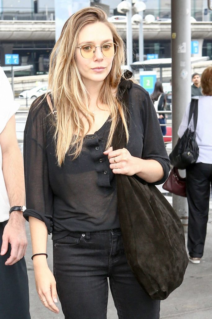 Elizabeth Olsen Arrives in Paris-1