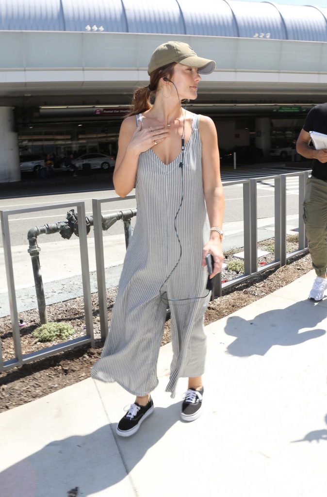 Minka Kelly Wears a Pinstriped Overalls at LAX Airport in Los Angeles-1