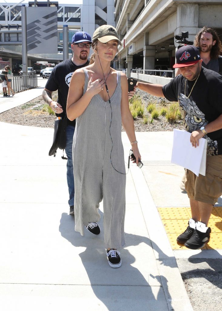 Minka Kelly Wears a Pinstriped Overalls at LAX Airport in Los Angeles-2