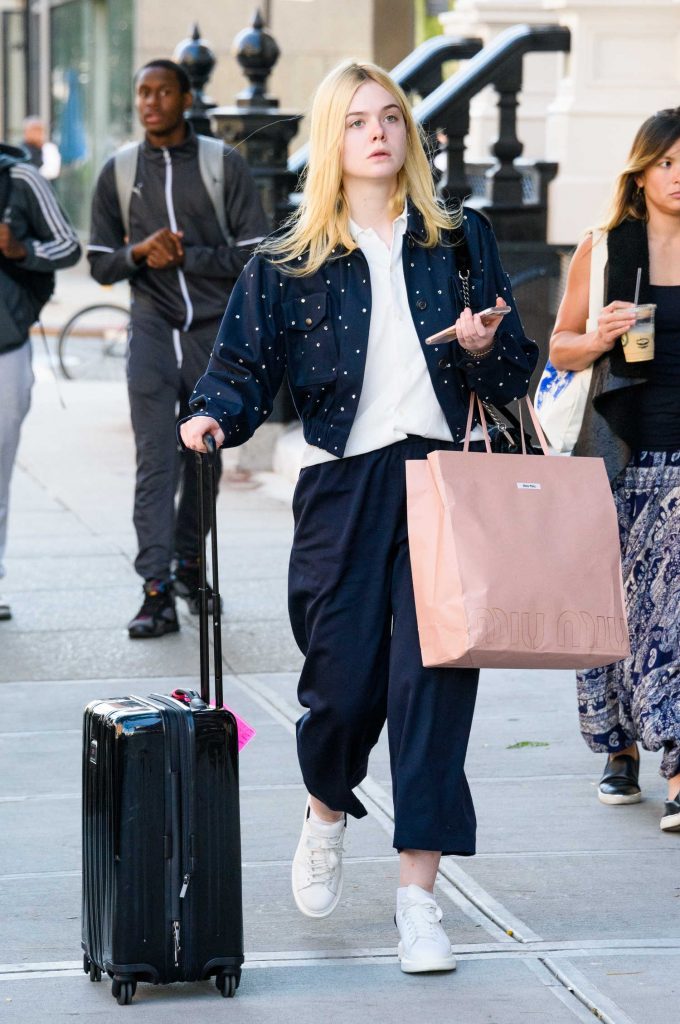 Elle Fanning Pulls Her Suitcase in NYC-3