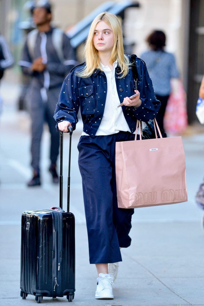 Elle Fanning Pulls Her Suitcase in NYC-4