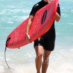 Angelique Kerber Takes Surfing Lesson at Trigg Beach in Perth, Australia