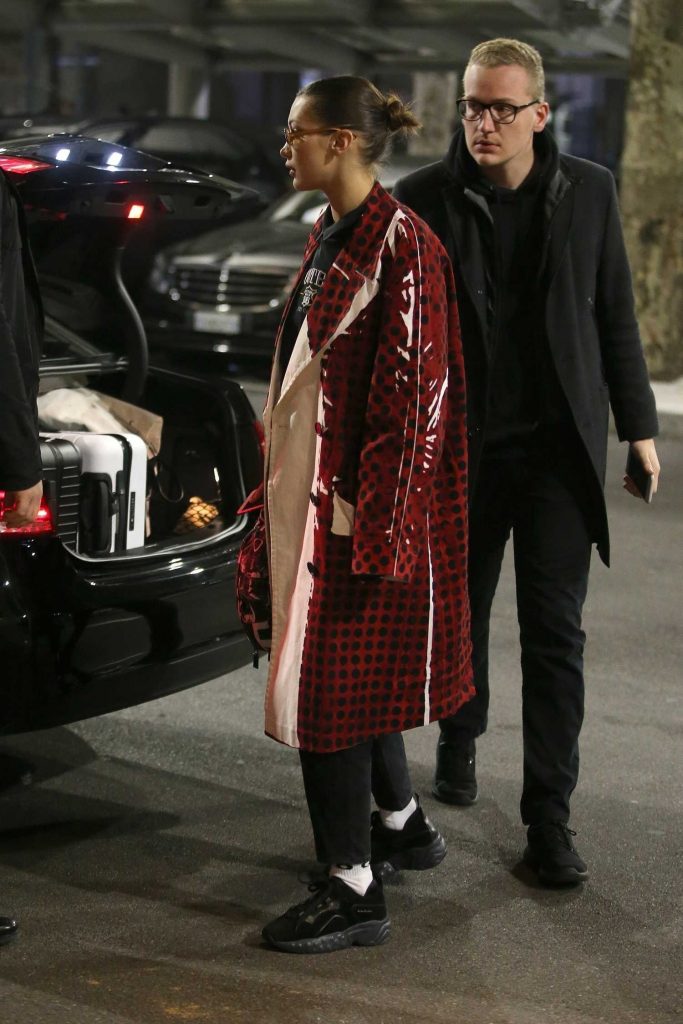 Bella Hadid Wears in a Red Checkered PVC Coat at Milan Airport in Milan-5