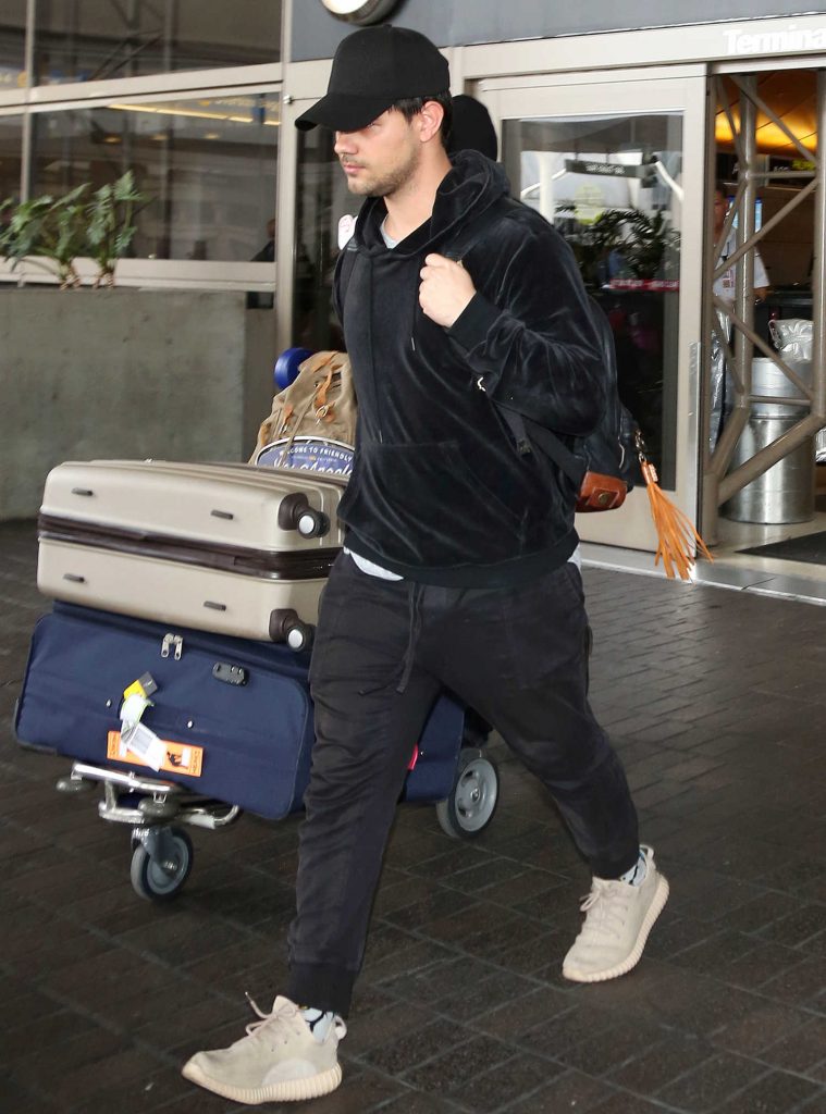 Taylor Lautner Arrives at LAX Airport in LA-4
