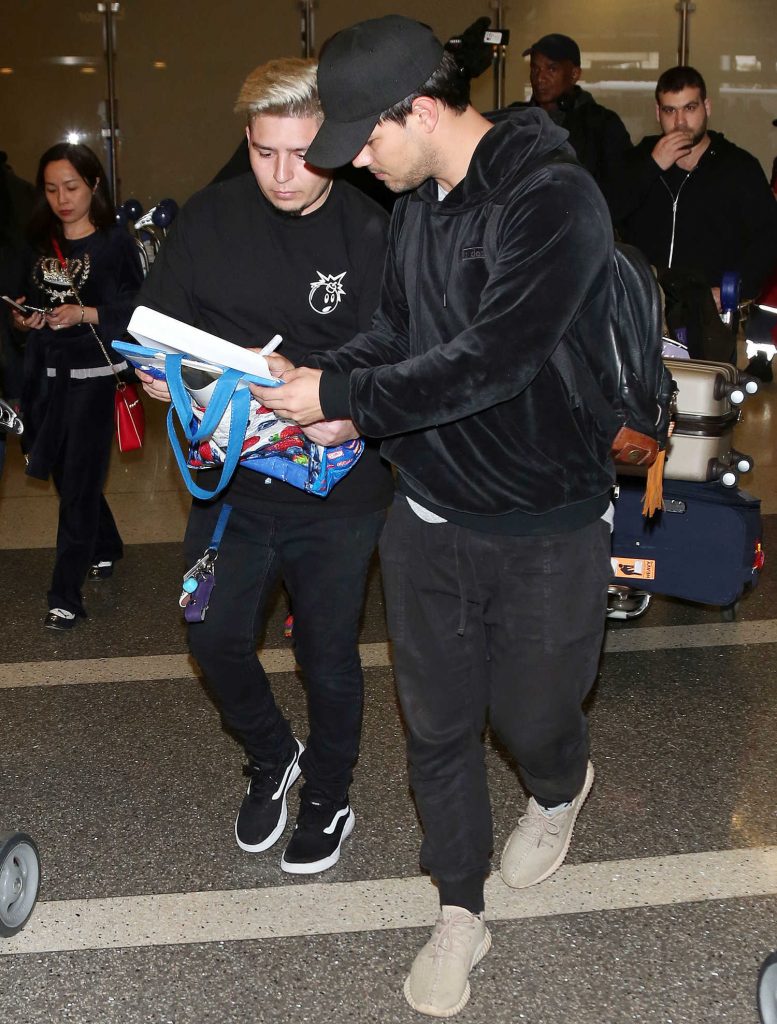 Taylor Lautner Arrives at LAX Airport in LA-5