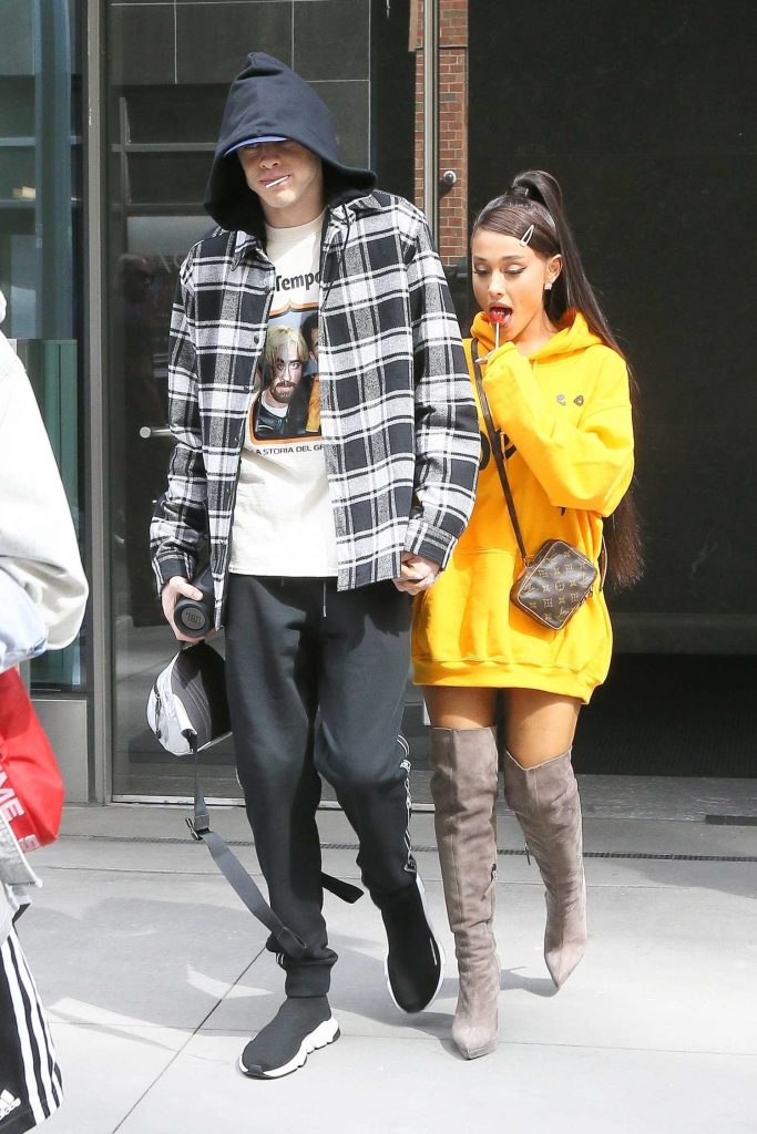 Ariana Grande Wears a Yellow Hoody Out in NYC-4