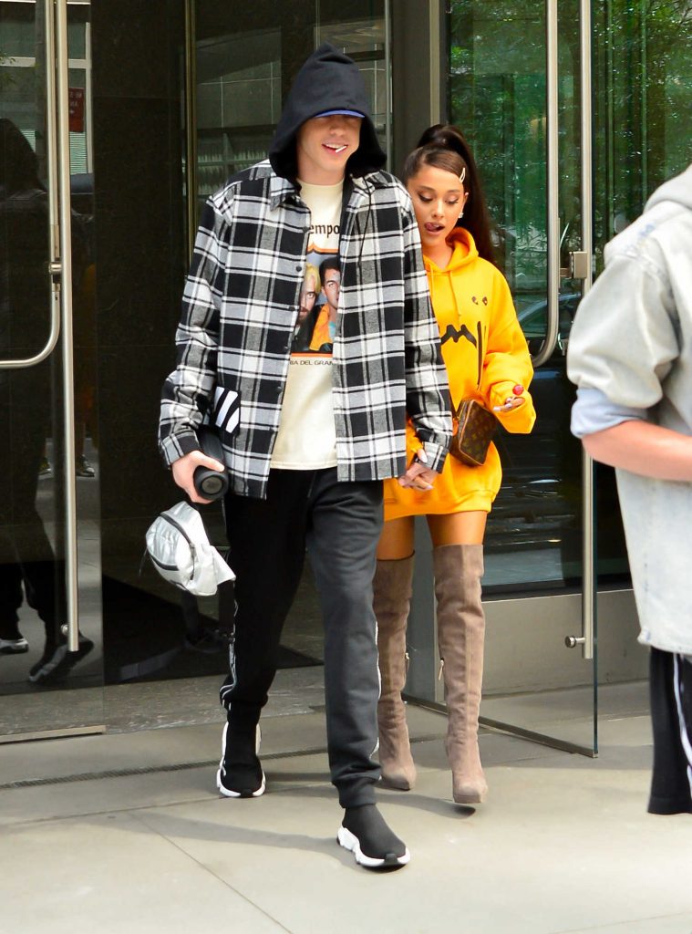 Ariana Grande Wears a Yellow Hoody Out in NYC-5