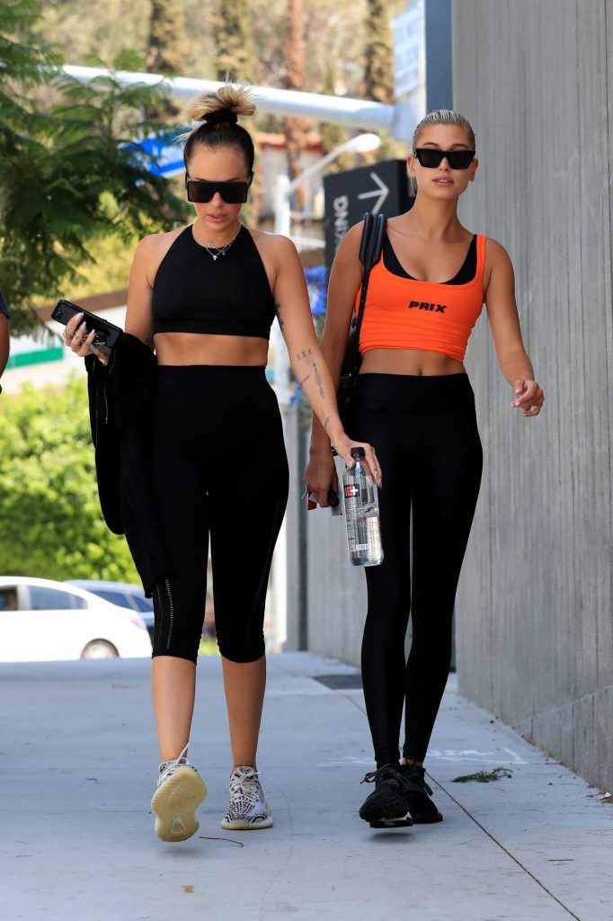 Hailey Baldwin in a Short Orange Tank Top Leaves the Gym in West Hollywood
