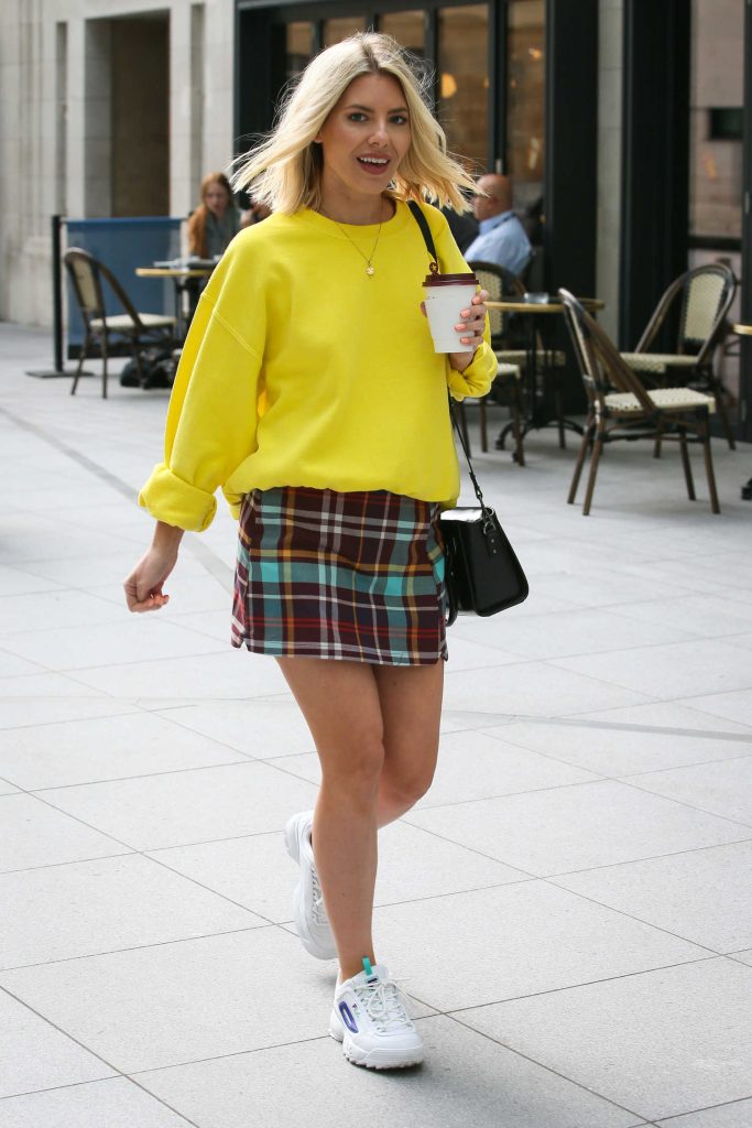 Mollie King in a Yellow Sweatshirt