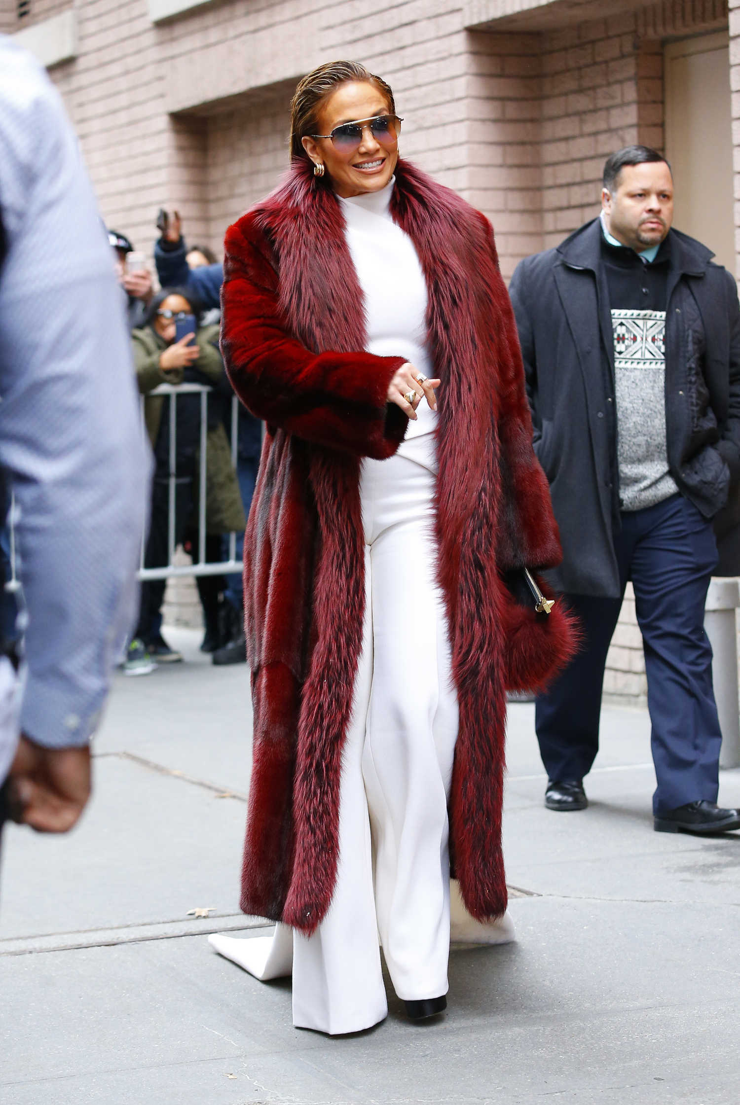 Jennifer Lopez in a Long Red Fur Coat Arrives at The View TV Show in