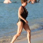 Emma Forbes in a Black Swimsuit on the Beach in Barbados