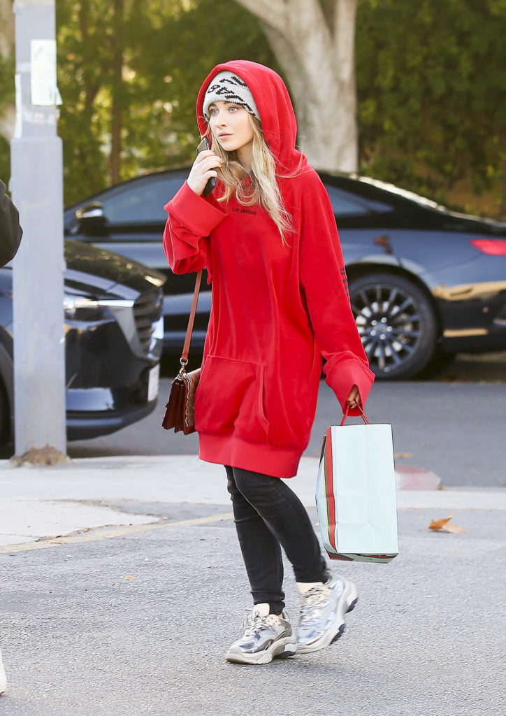 Sabrina Carpenter in a Red Oversized Hoody