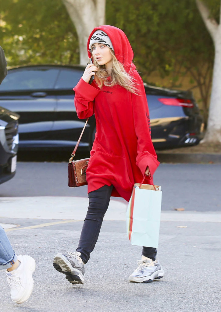 Sabrina Carpenter in a Red Oversized Hoody
