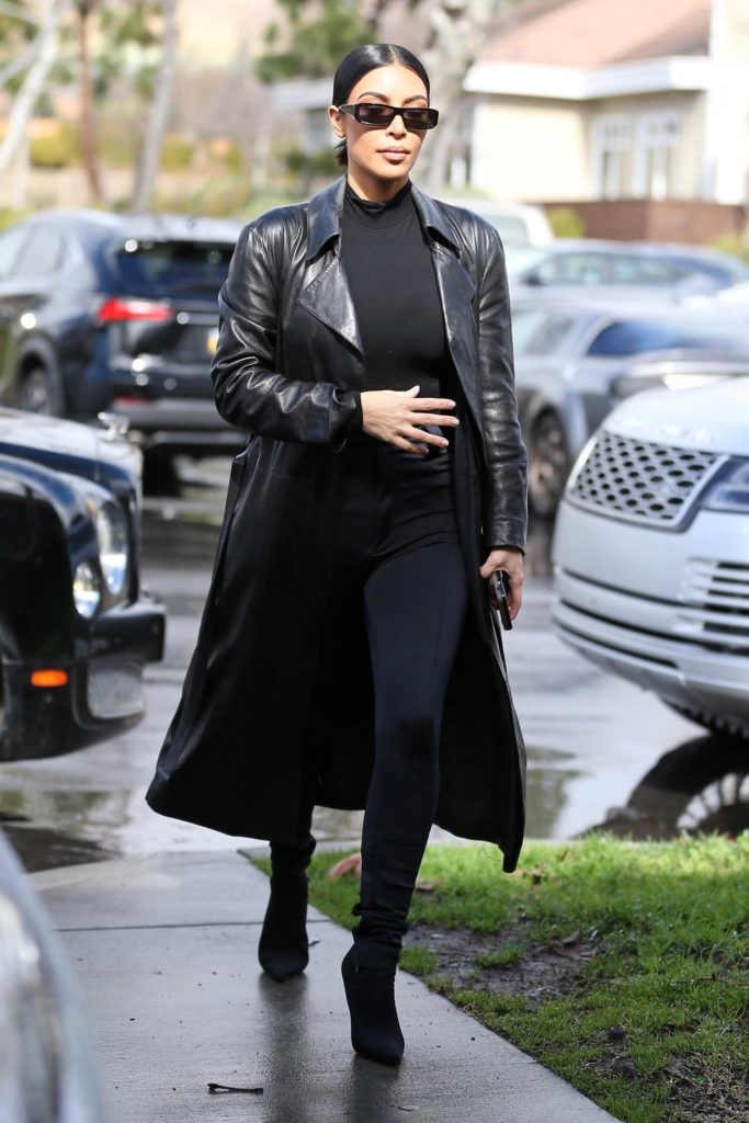 Kim Kardashian in a Black Leather Trench Coat