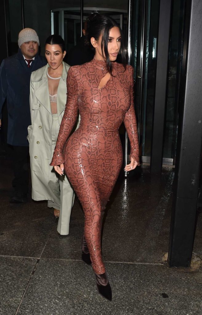 Kim Kardashian in a Brown Form Fitting Dress