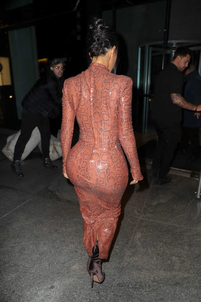 Kim Kardashian in a Brown Form Fitting Dress