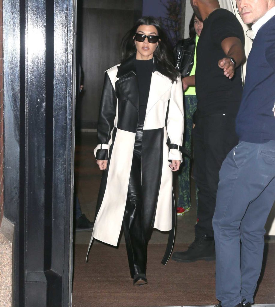 Kourtney Kardashian in a Black and White Leather Trench Coat