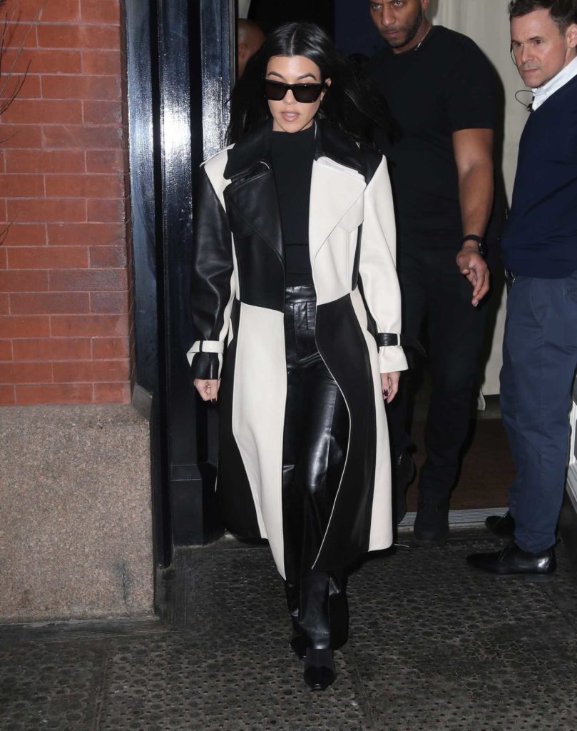 Kourtney Kardashian in a Black and White Leather Trench Coat