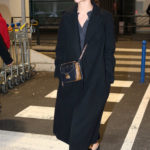 Alicia Vikander in a Black Coat Arrives at CDG Airport in Paris