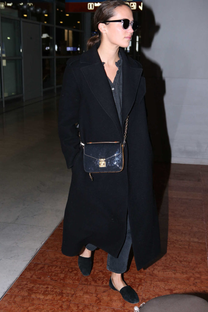 Alicia Vikander in a Black Coat