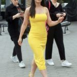 Emeraude Toubia in a Yellow Dress Arrives on Extra at Universal Studios in Hollywood