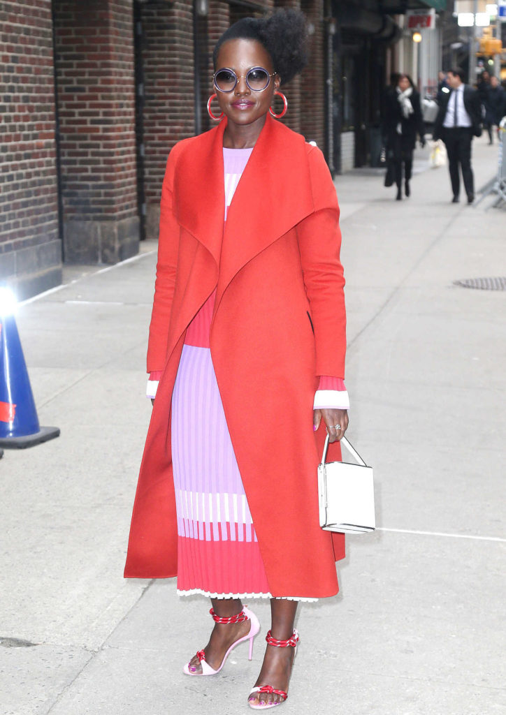 Lupita Nyong'o in a Red Coat