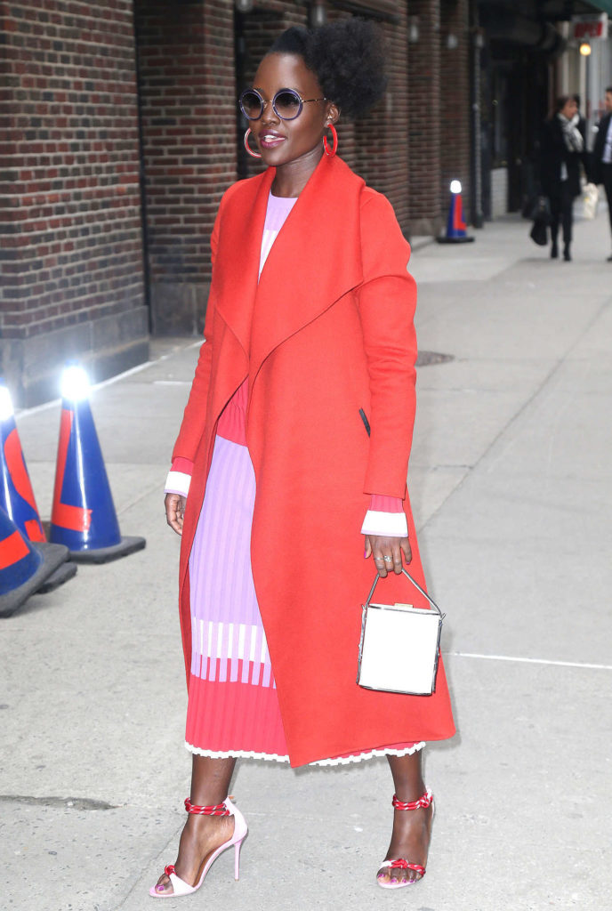 Lupita Nyong'o in a Red Coat