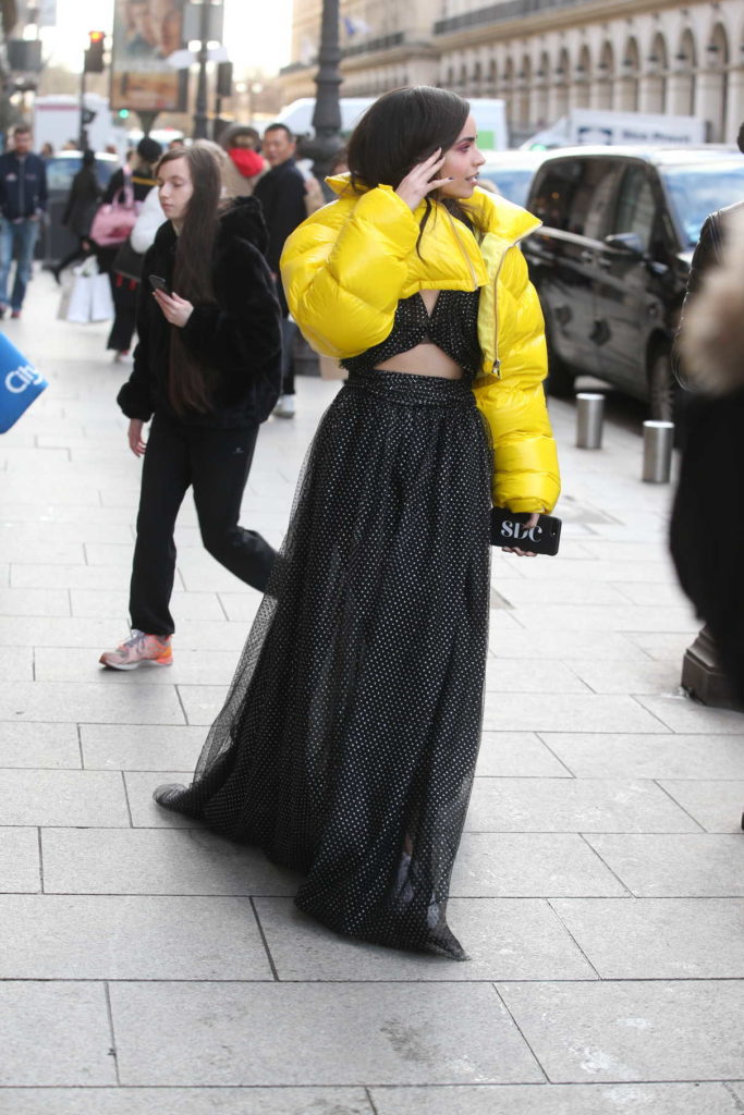 Sofia Carson in a Yellow Puffer Jacket