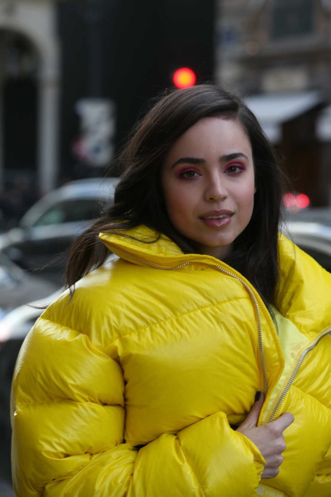 Sofia Carson in a Yellow Puffer Jacket