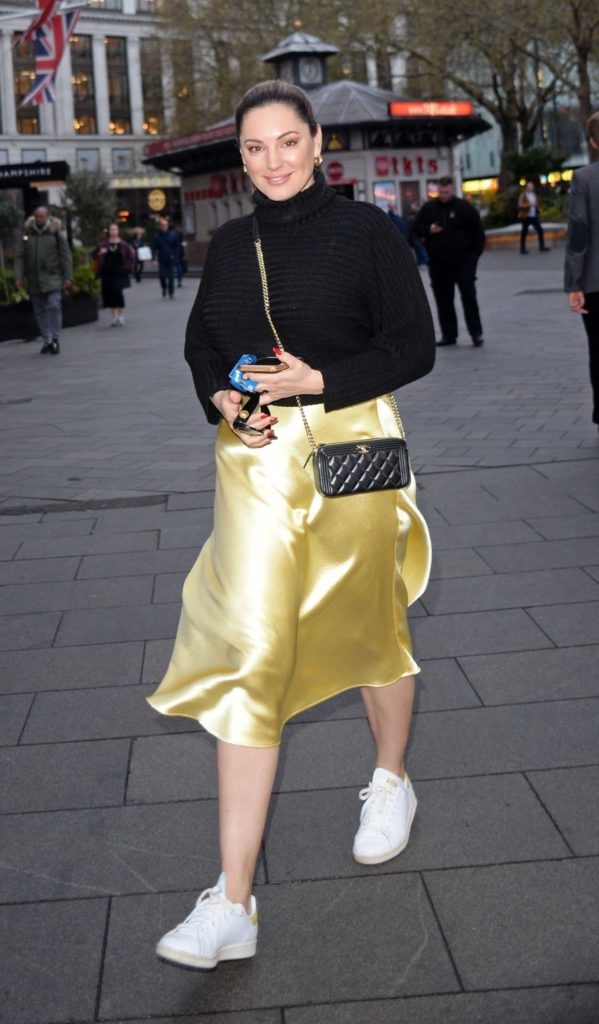 Kelly Brook in a Gold Skirt