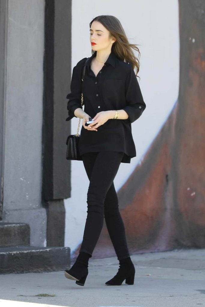 Lily Collins in a Black Blouse