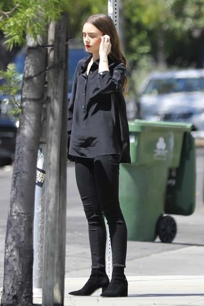 Lily Collins in a Black Blouse