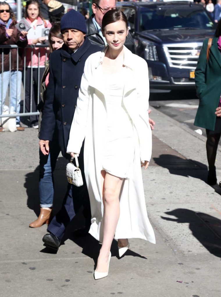 Lily Collins in a White Trench Coat