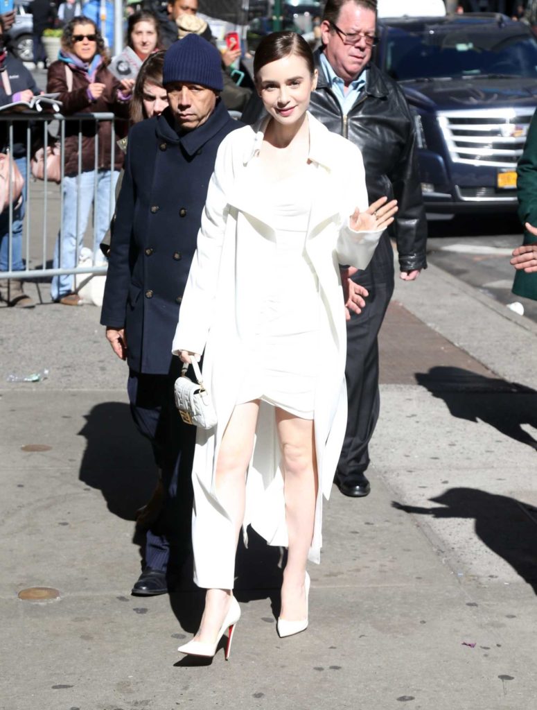 Lily Collins in a White Trench Coat Arrives at Good Morning America in ...
