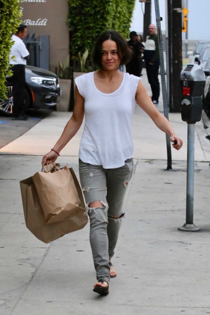 Michelle Rodriguez in a Gray Ripped Jeans