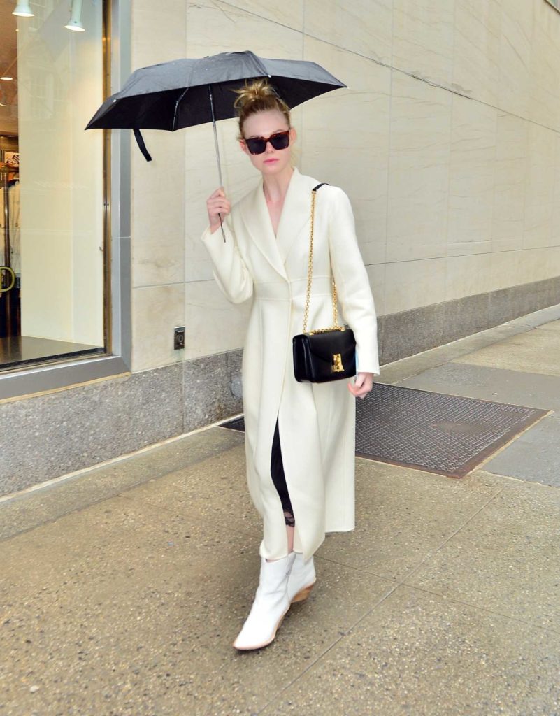 Elle Fanning in a White Coat