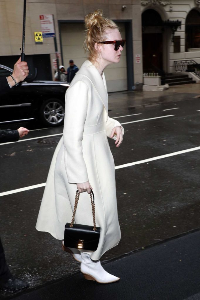 Elle Fanning in a White Coat