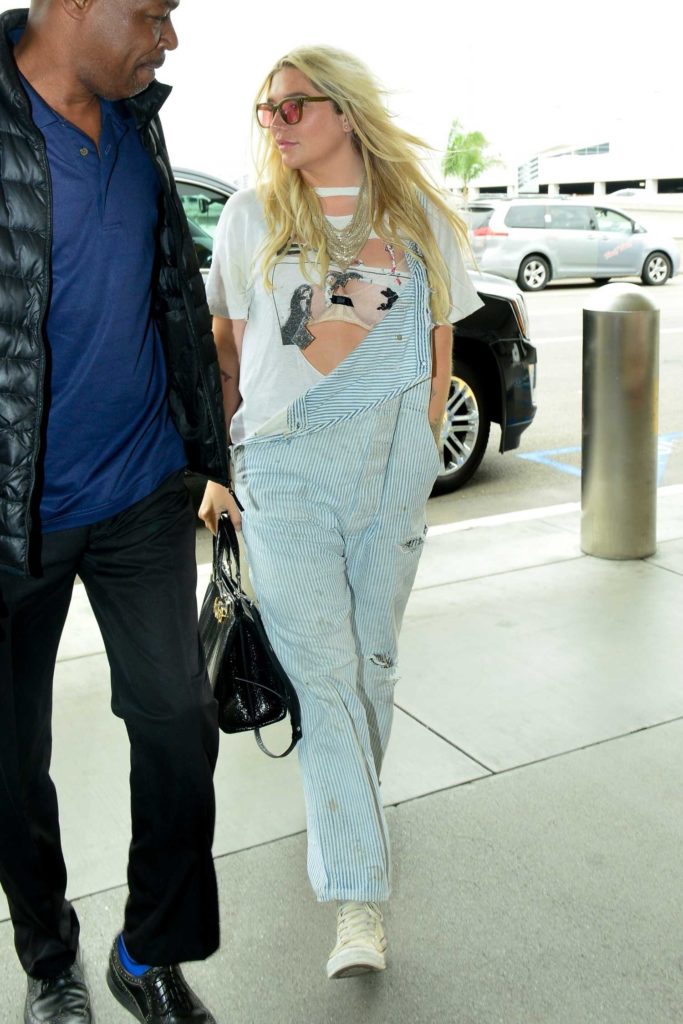 Kesha in a Striped Jumpsuit