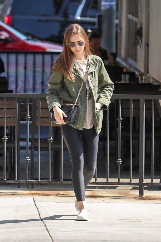 Lily Collins in a Green Jacket