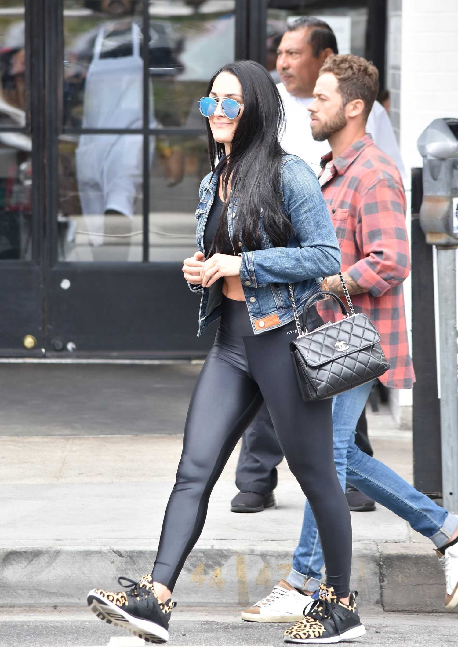 nikki bella rocks a black spandex jumpsuit and snakeskin boots while  visiting a friend in brentwood, california-290220_6