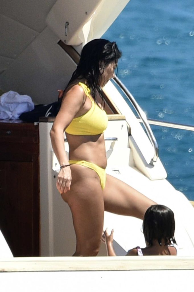 Kourtney Kardashian in a Yellow Bikini