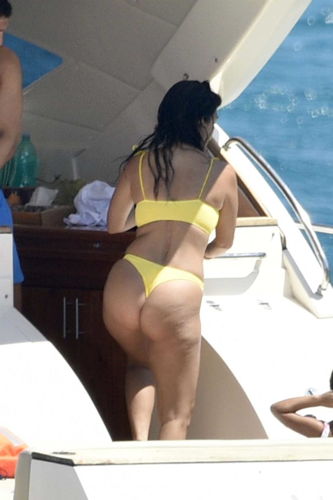 Kourtney Kardashian in a Yellow Bikini