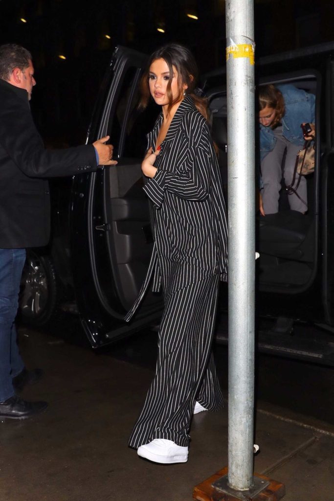 Selena Gomez in a Black Striped Suit