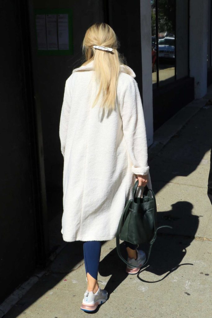 Witney Carson in a White Coat
