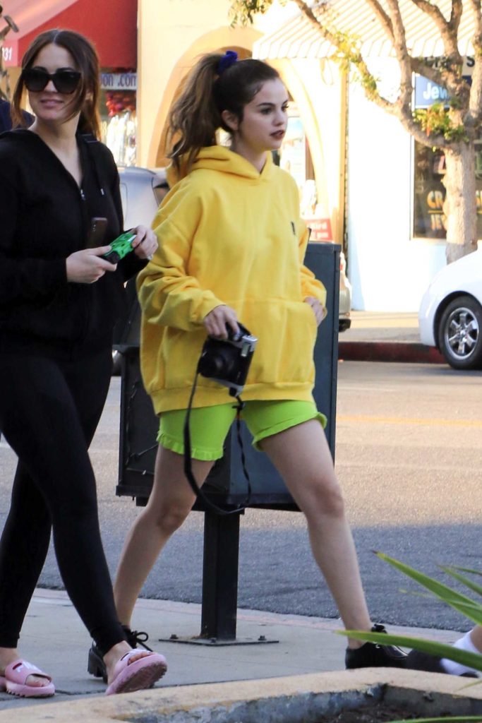 Selena Gomez in a Yellow Hoody