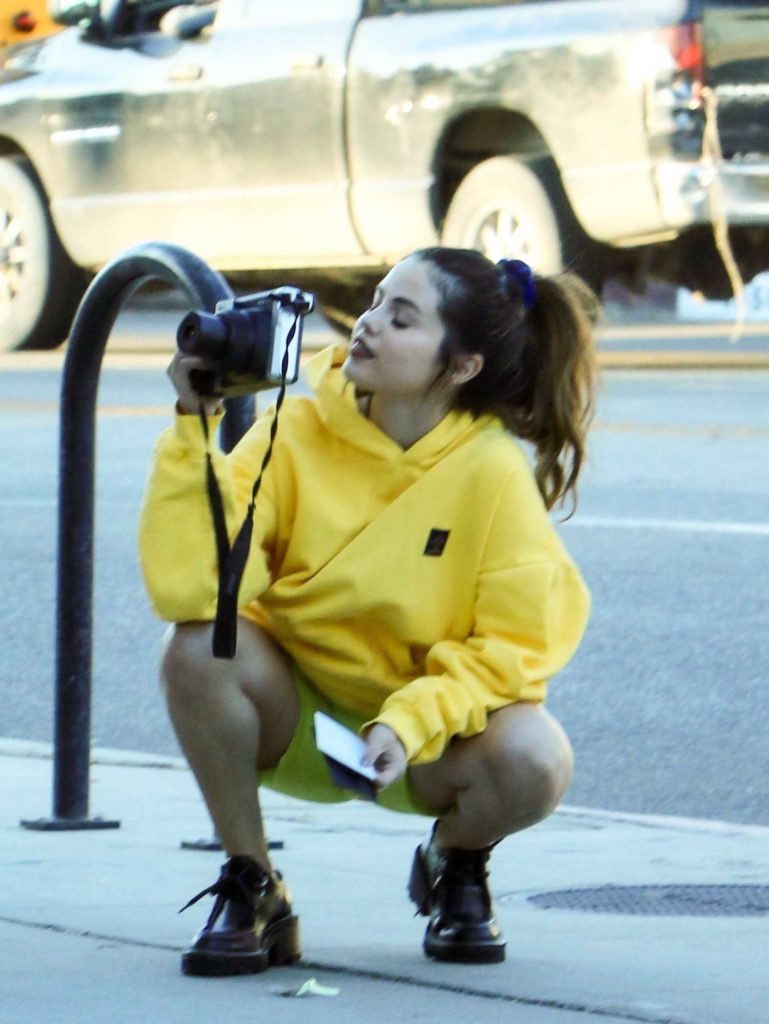Selena Gomez in a Yellow Hoody