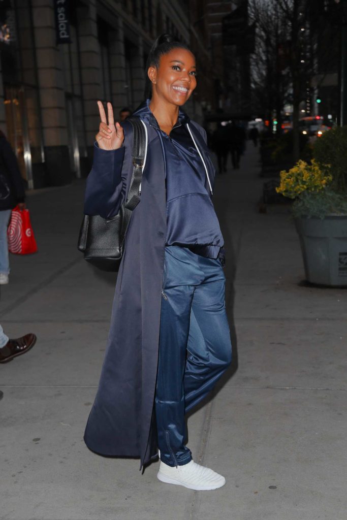 Gabrielle Union in a Black Trench Coat