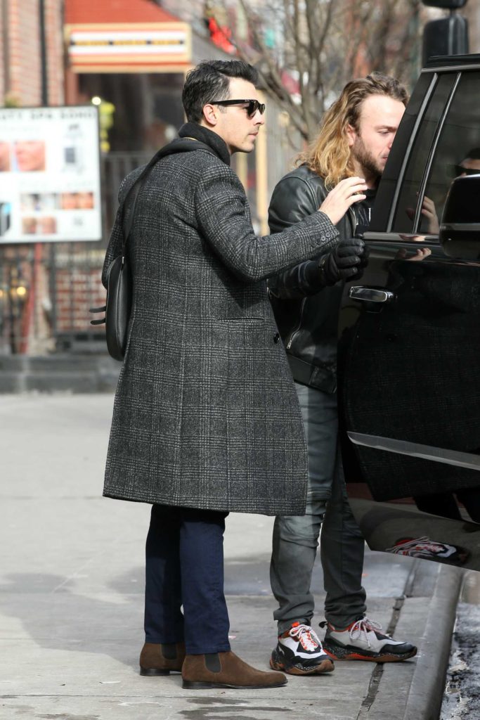 Joe Jonas in a Gray Coat